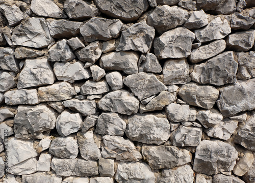 rocky stone wall background texture - large natural rocks