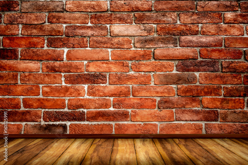 Red bricks wall with wood floor texture background.