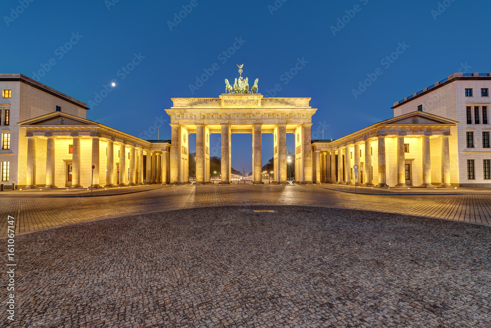 The famous Brandenburg Gate in Berlin illuminated at dawn