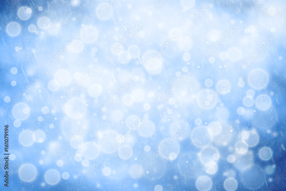 Abstract blue color bokeh with snowflake droplets. Fresh snowy New Year and Christmas background with copy space background. Abstract blue color bokeh with snowflake droplets. Fresh snowy New Year and Christmas background with copy space background.