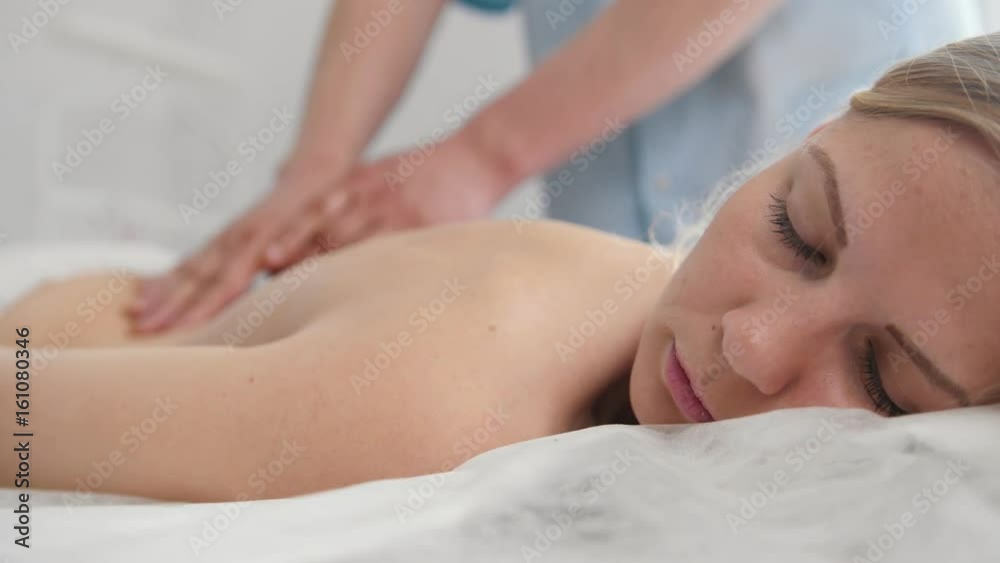 The girl is given a massage. Tibetan Medicine The girl is given a massage. Tibetan Medicine