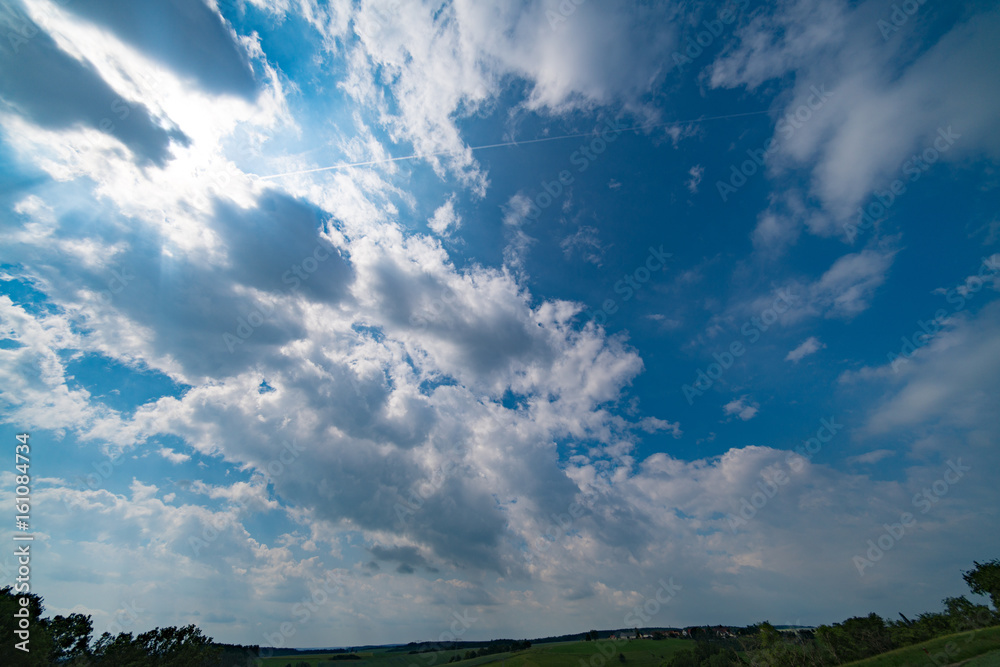 Green field and clear cloudy sky Green field and clear cloudy sky
