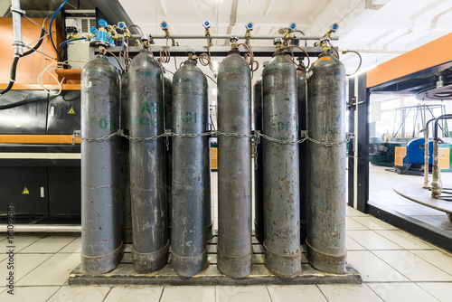 Фотография Rows of gray gas cylinders.