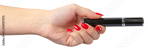 woman hand holding eyelash brush