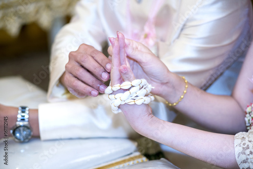 The sacred ties of the couple in the wedding ceremony according to Thai traditional