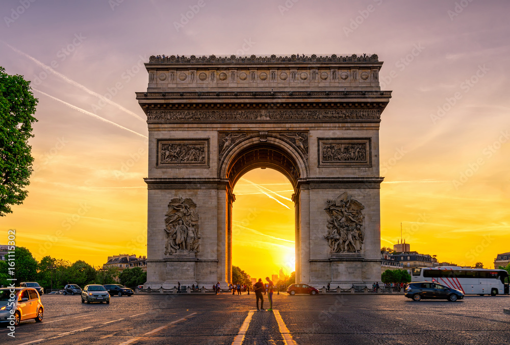 Paris Arc de Triomphe (Triumphal Arch) in Chaps Elysees at sunset