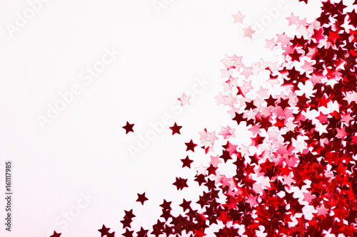 Abstract background with scattered Confetti stars.