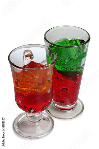 Fruit cocktail in a glass goblet on a white background