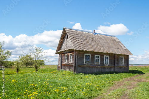 Rural house near the road in sunlight