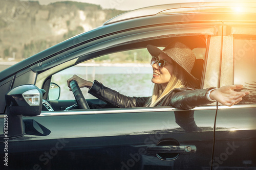Woman at spreeng time. Yoyng happines female in hat and sunglass photo