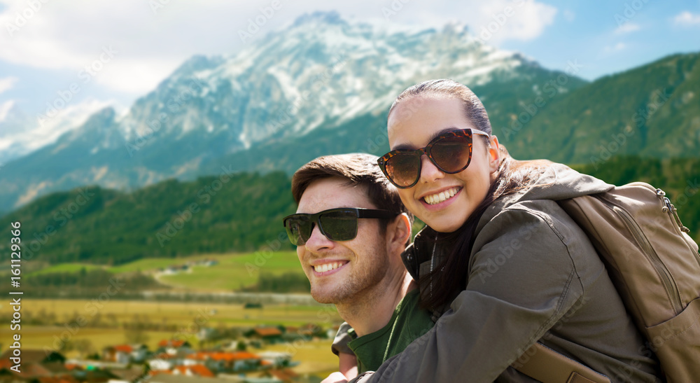 happy couple with backpacks traveling in highlands happy couple with backpacks traveling in highlands