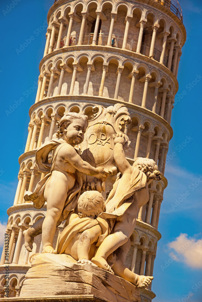 The charming landscape of sculptural composition on the background of the Leaning Tower of Pisa in Italy, Europe