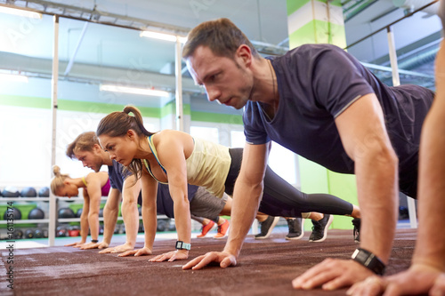 group of people exercising in gym © Syda Productions