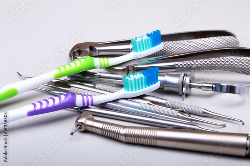 dental care toothbrush with dentist tools isolated on white background. Selective focus.