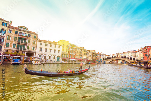 A magical landscape with gondola on the Grand Canal on a sunny day in Venice, Italy, Europe. (Romantic travel, honeymoon - concept) © anko_ter