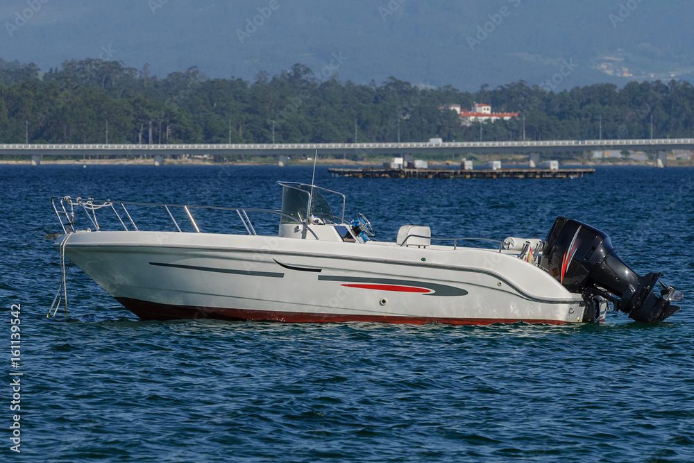 Fototapeta premium white motor boat at anchor