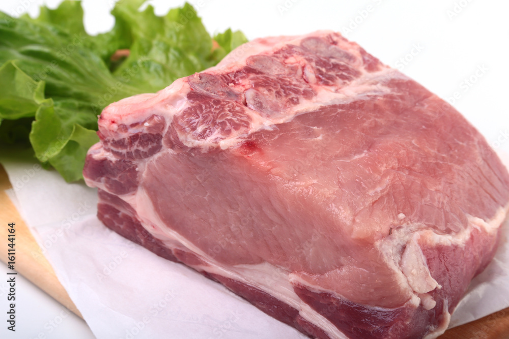 Raw pork chops with herbs and spices on cutting board. Ready for cooking. Raw pork chops with herbs and spices on cutting board. Ready for cooking.
