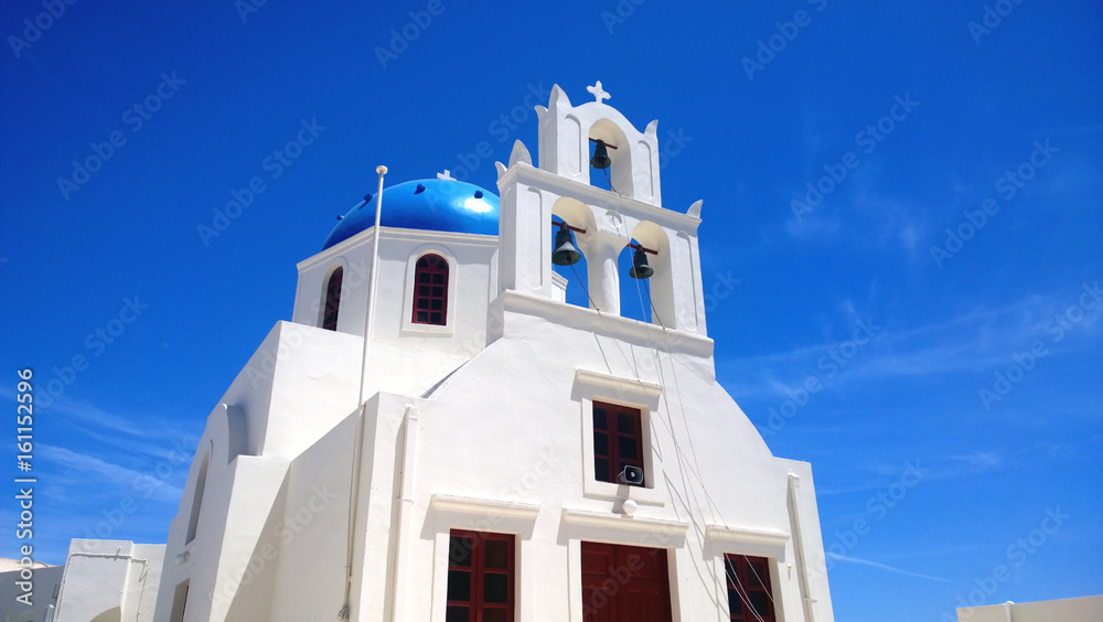 One of the famous blue and white buildings in Oia on Santorini island in Greece