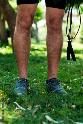 Legs of a man with jump rope © hidako