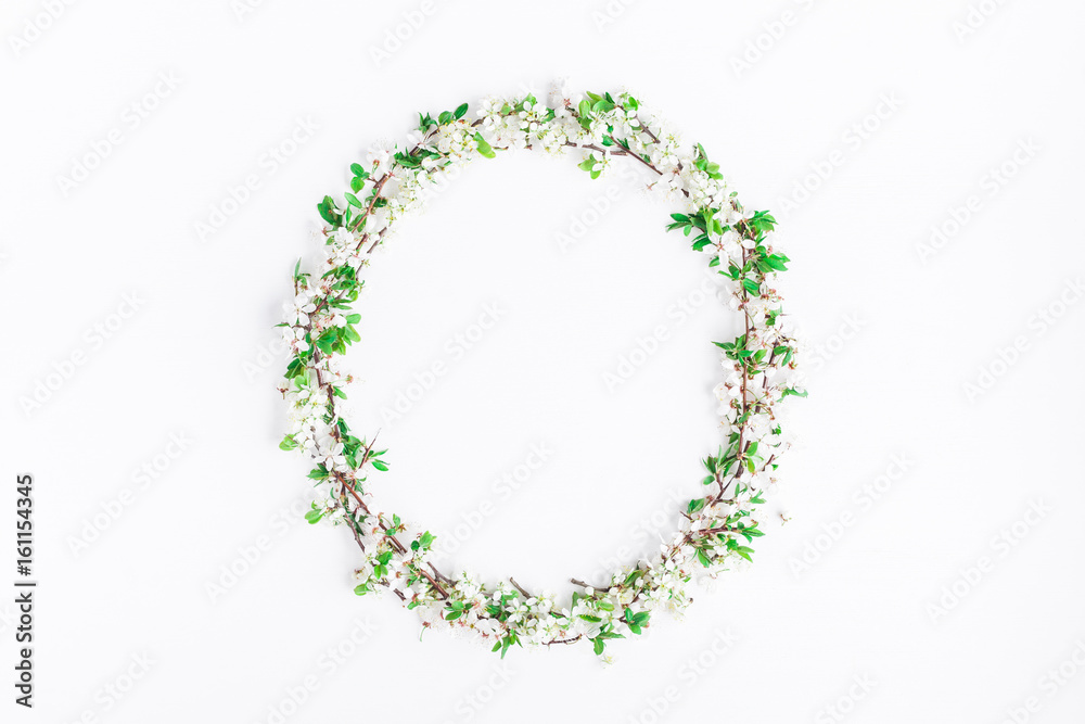 Flowers composition. Frame made of apple tree flowers on white background. Flat lay, top view Flowers composition. Frame made of apple tree flowers on white background. Flat lay, top view