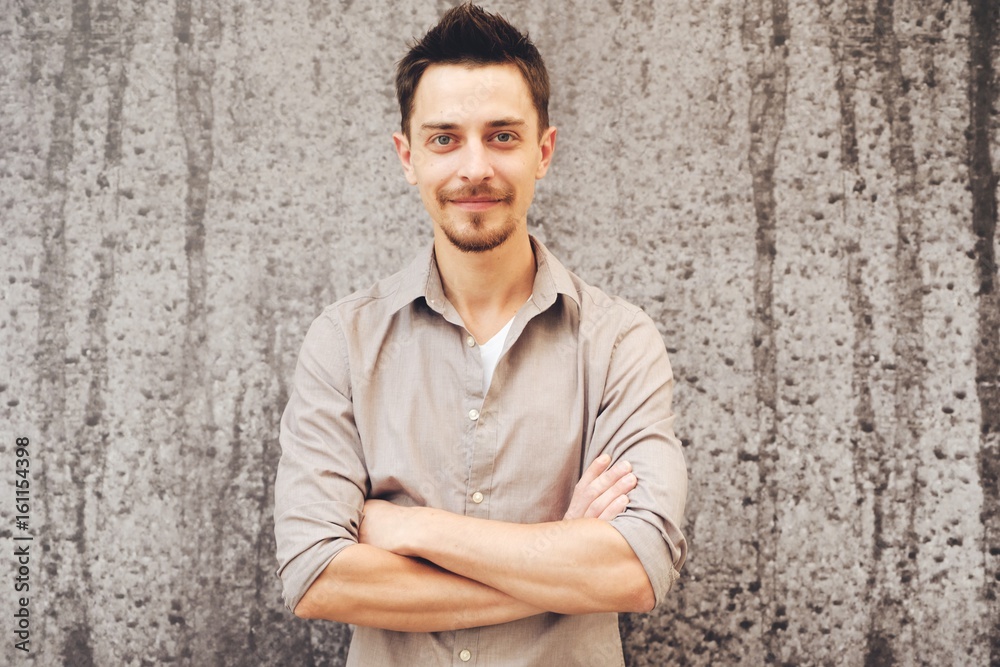 Handsome man outdoors portrait in the city. Warm colors Handsome man outdoors portrait in the city. Warm colors