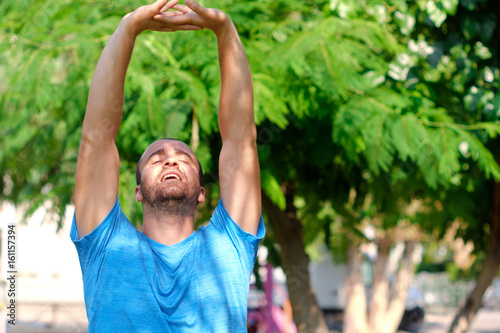 man exercise and stretch in a park