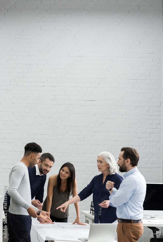 © Drobot Dean - Group of serious business people having a brainstorm meeting © Drobot Dean - Group of serious business people having a brainstorm meeting