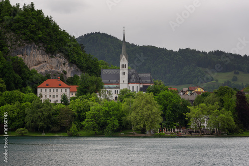 Bled Lake, shoreline mountain, alpine village in sunny weather, Slovenia, Europe. © djevelekova