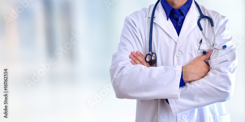 Caucasian general doctor half body crossed arms concept