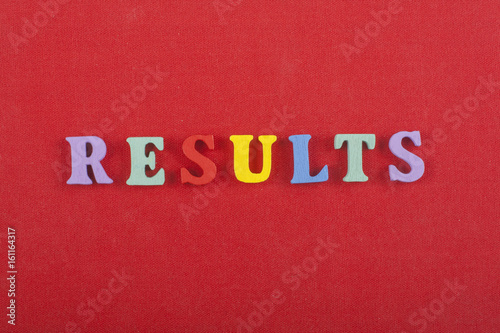 RESULTS word on red background composed from colorful abc alphabet block wooden letters, copy space for ad text. Learning english concept.