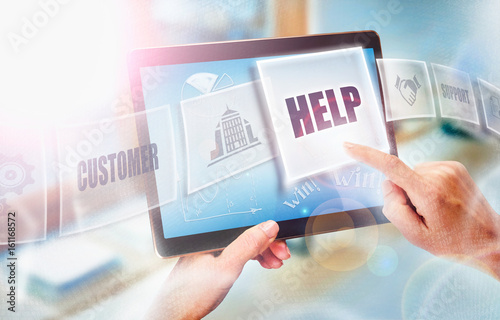 A businesswoman selecting a Help business concept on a futuristic portable computer screen.