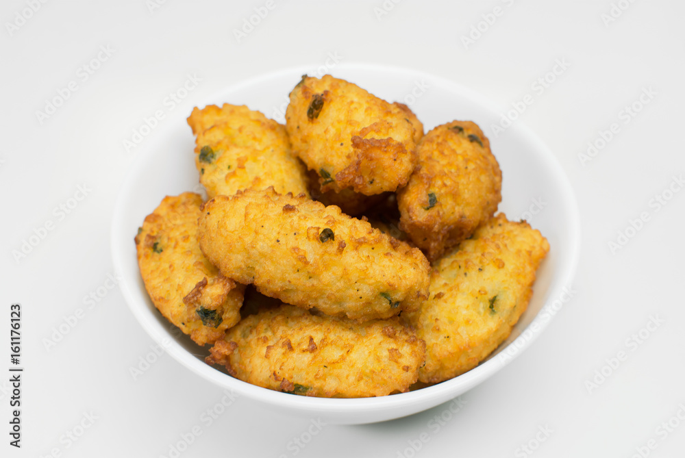 Fried rice balls in white background seen from above close Fried rice balls in white background seen from above close