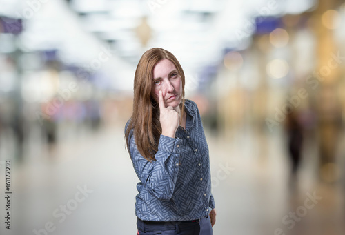 Pretty business woman looking something over blur background