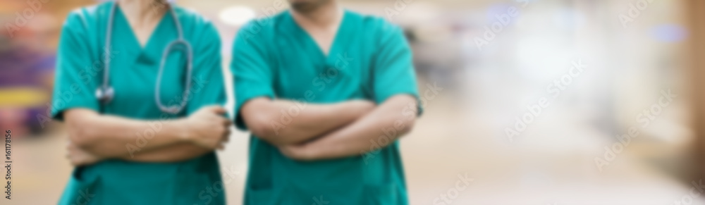 Blurred banner image of two surgeons.