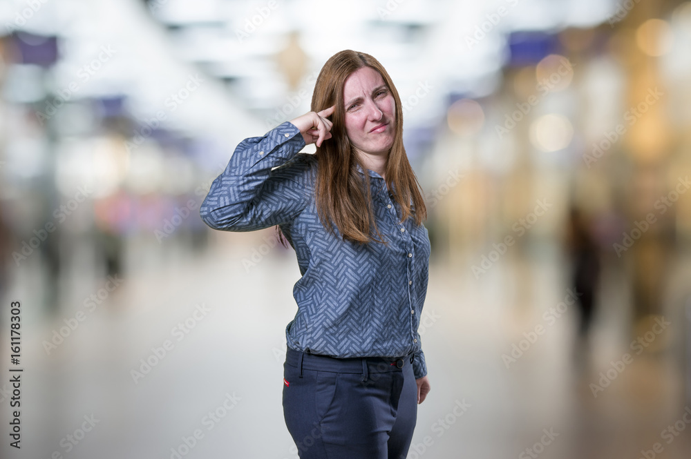 Pretty business woman making crazy gesture