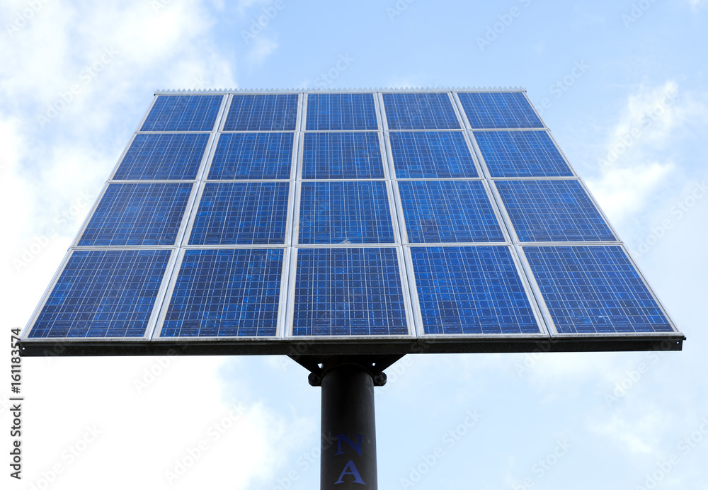 solar panels and blue sky with clouds