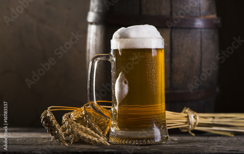 Photography Glasses of light and dark beer on a pub background.