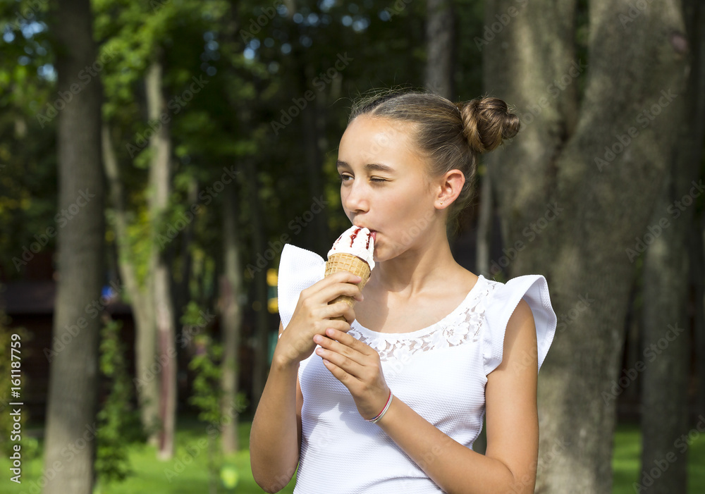 Girl eating ice cream in the park Girl eating ice cream in the park