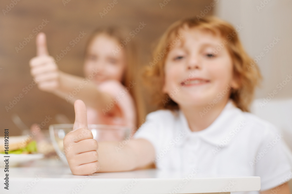 Admirable active children showing how much they enjoying morning Admirable active children showing how much they enjoying morning