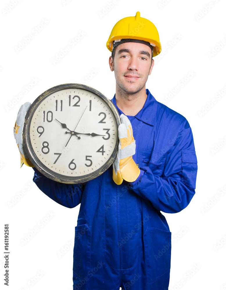 Young workman worried about the time on white background Young workman worried about the time on white background