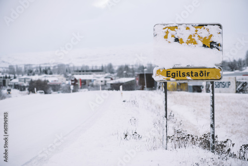 Egilsstadir sign in the winter Iceland, covered in snow by the road