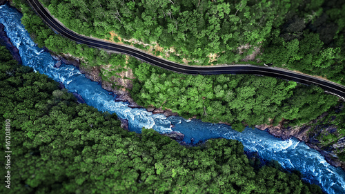 Aerial view of Mountain river and road. Mountain gorge