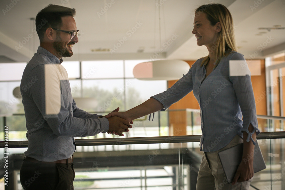 Business people shaking hands in office. Successful business people. Business people shaking hands in office. Successful business people.