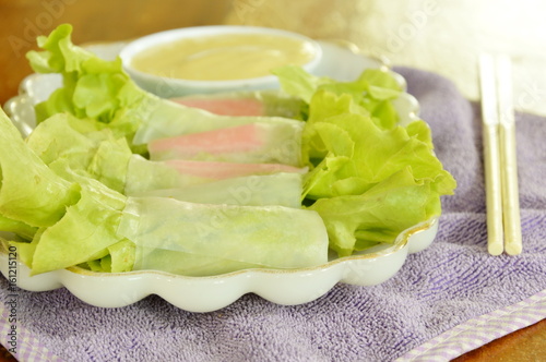 imitation crab stick and green oak wrapped flour paste dipping cream sauce on plate