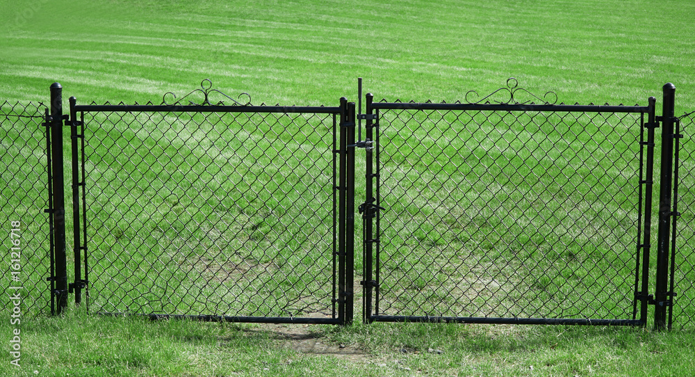 chainlink fence gate outside soccer field