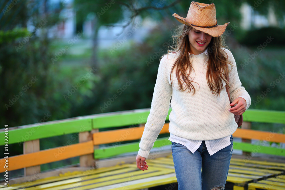 Positive teenage modern hipster woman walking, smile, street lifestyle, moment, happy, urban background