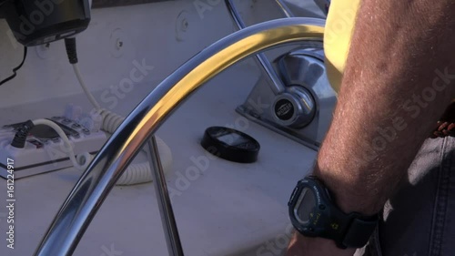 Man Steering Boat 