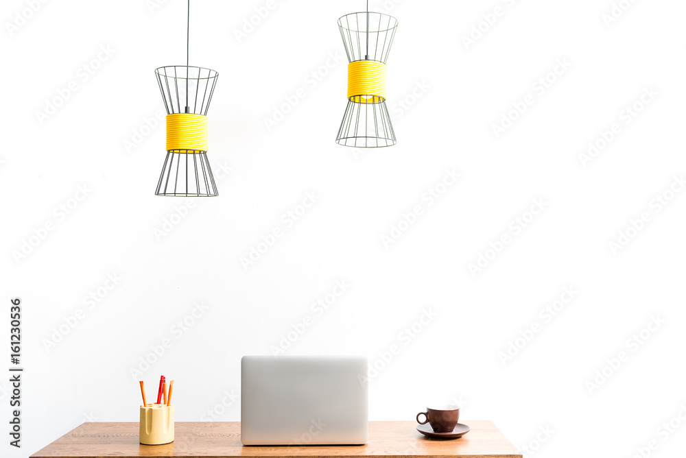 White open laptop and mug with coffee on table White open laptop and mug with coffee on table