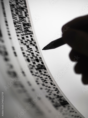 Scientist marking up DNA autoradiogram photo