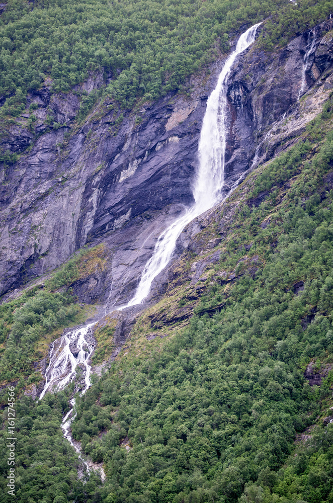 waterfall at the edge of the famous Geirangerfjord in Norway